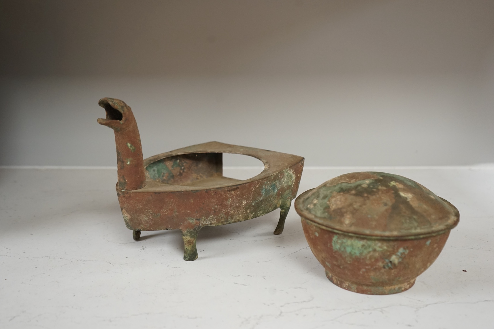 A Chinese bronze zoomorphic stove, Han Dynasty, 21cm long. Condition - fair